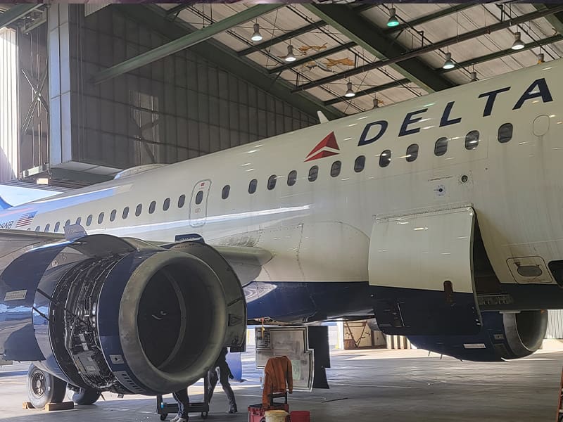 a large passenger jet sitting on top of a building